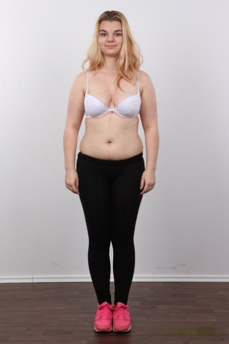 Chunky blonde girl Aneta stands fully clothed and then as naked as one can get 24034361