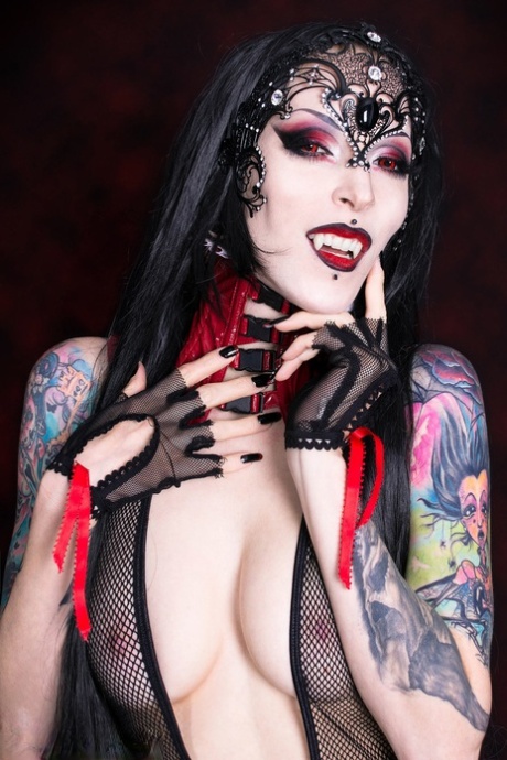 Goth girl Razor Candi works her tits and twat clear of see thru onesie 61909419