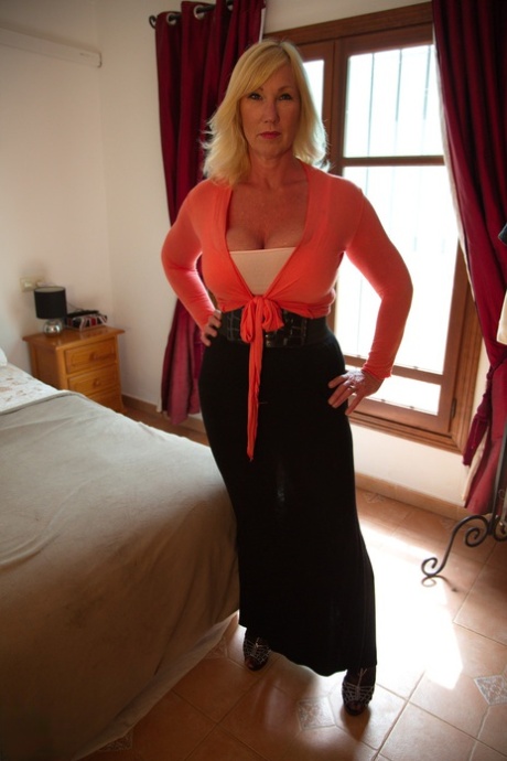 Mature blonde Melody Charm unveils her big naturals prior to masturbating 73795496