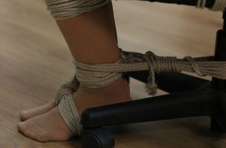 Caucasian chick sports a gag while tied to a computer chair 50116797