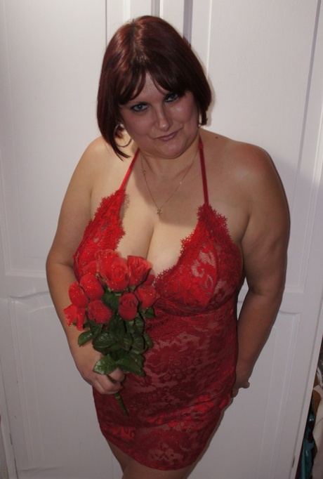 Busty mature lady holds roses while being joined by topless girlfriends 47450641