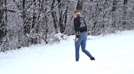 Blonde girl Gianna Ray pulls down ripped jeans to pee on snow-covered ground 10015347