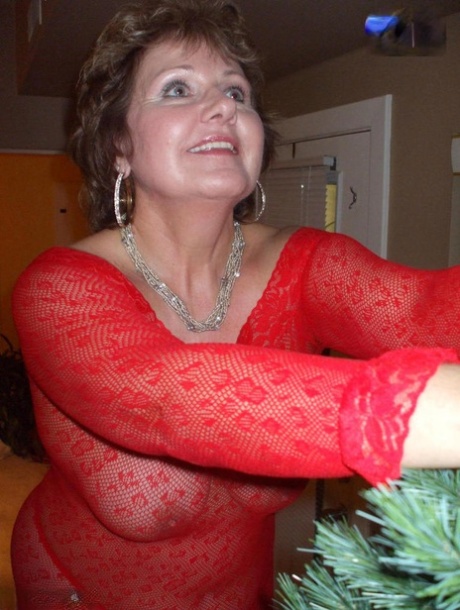 Mature lady Busty Bliss exposes her breasts during a Christmas celebration 52851957