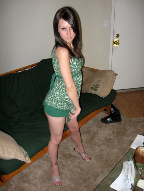 Brunette teen gets completely naked during solo action on a sofa 62922442