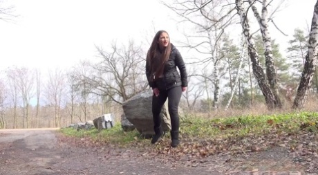 Nicolette Noir pulls down her pants behind a boulder for an urgent piss 77563679