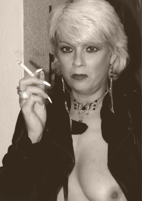 Older blonde Dimonty shows her tits and snatch while smoking a cigarette 36466138