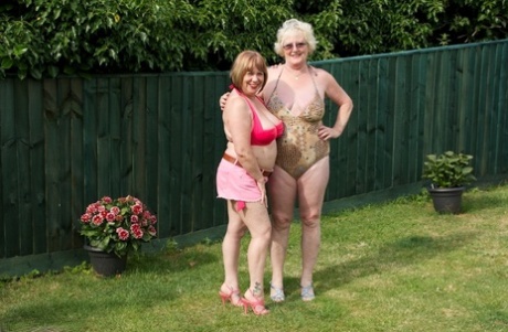 Older British lesbians Speedy Bee and Claire Knight have sex in a backyard 82013196