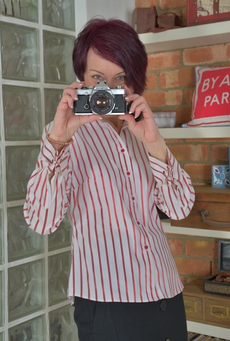 Older solo babe Penny Brooks striking sexy fully clothed poses 62260235